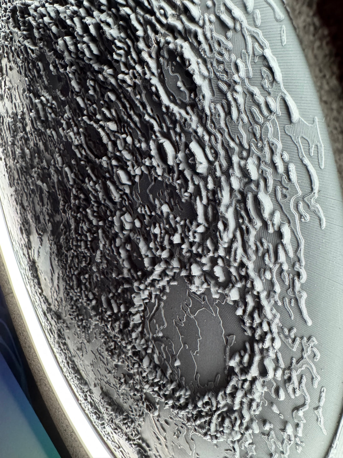 Real photo of the 3D printed crater terrain relief on the Pasithea Living Moon before finishing
